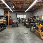 Warehouse workspace illuminated by 4ft LED Tube 17W Type B lights installed on ceiling beams