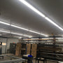 Bright industrial workspace lit by 8ft LED Tube 3 CCT Selectable 40W FA8 Type B fixtures overhead