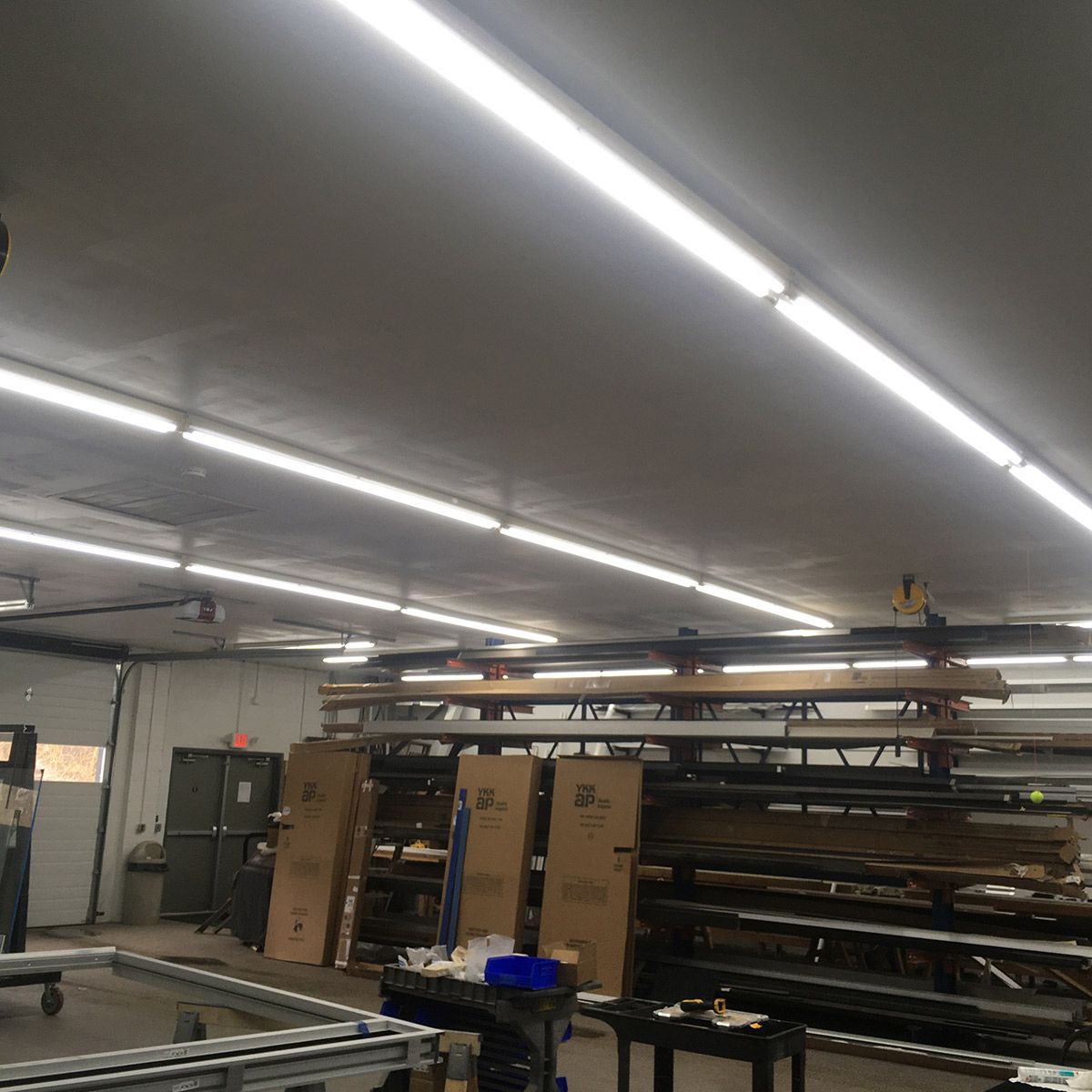 Bright industrial workspace lit by 8ft LED Tube 3 CCT Selectable 40W FA8 Type B fixtures overhead