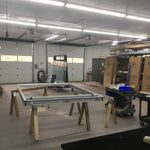 Workshop illuminated by multiple 8ft LED Tube 3 CCT Selectable 40W FA8 Type B lights with bright white lighting