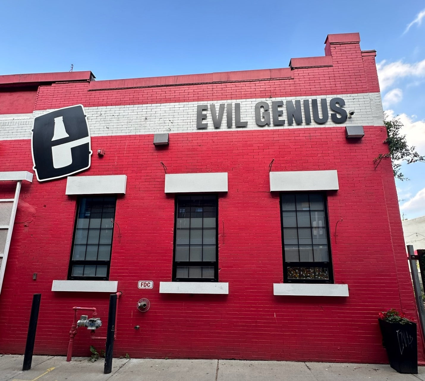 Evil Genius Brewing Company exterior shot showing LED wall pack lights that replaced older lights for improved energy use and cost savings