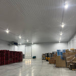Warehouse interior illuminated by UFO LED High Bay 2 CCT lights with adjustable beam angles and wattages